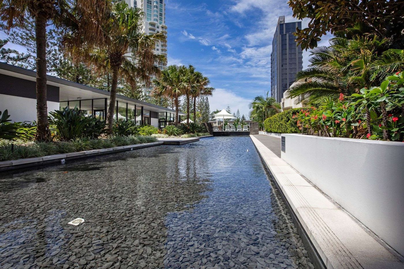 Ultra Broadbeach zen gardens with lush tropical landscaping and water features
